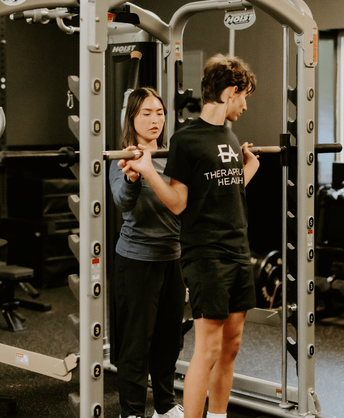 EA professional volunteer doing physical therapy services with a client