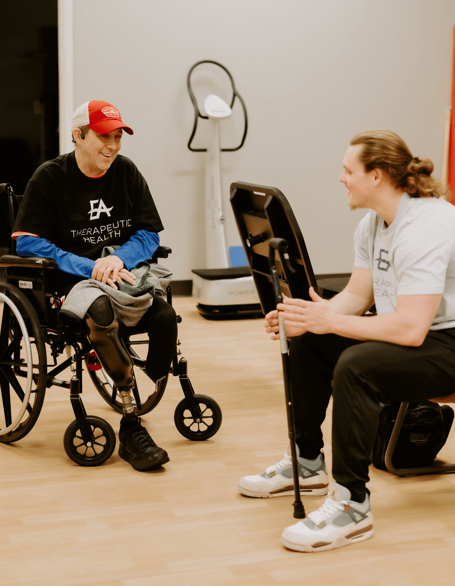 amputee-physical-therapy-client-in-wheelchair-with-physical-therapist